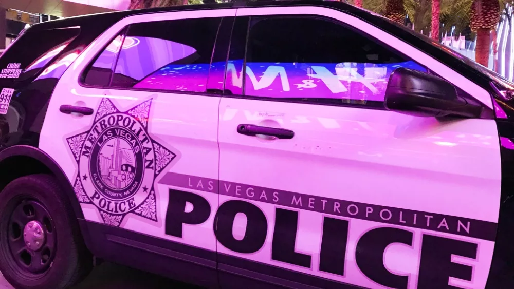 Patrol car of the Las Vegas Metropolitan Police Department parked under the neon lights of Las Vegas Boulevard. LAS VEGAS, NEVADA, USA - FEBRUARY 2019