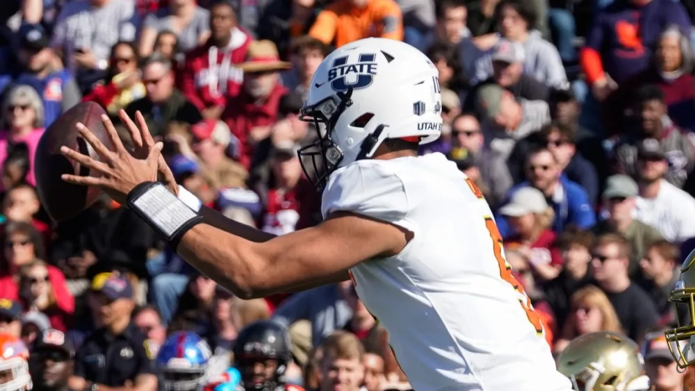 Utah State Aggies quarterback Jordan Love (5) takes the snap during the 2020 Reese's Senior Bowl at Ladd-Peebles Stadium. MOBILE, ALABAMA / USA - JANUARY 25, 2020