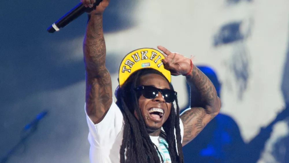 Rapper Dwayne Michael Carter, Jr. aka Lil Wayne performs in concert as part of America's Most Wanted Tour at Sleep Train Arena on August 28, 2013 in Sacramento, California.