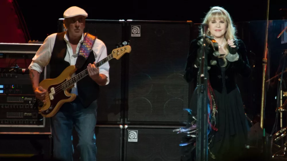 SACRAMENTO, CA - JULY 6: John McVie (L) and Stevie Nicks of Fleetwood Mac perform in support of the bands' Extended Play release at Sleep Train Arena on July 6, 2013 in Sacramento, California.