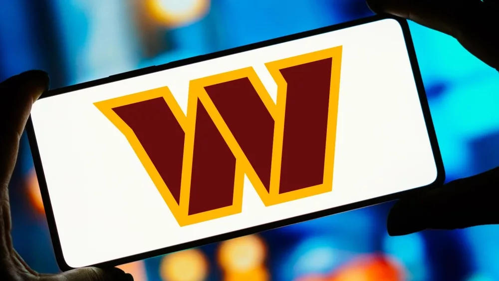 In this photo illustration, the Washington Commanders logo is displayed on a smartphone screen