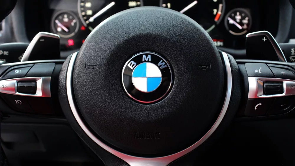 BMW X4 M Performance steering wheel. BMW X4 interior. BMW X4 dashboard. New car SUV steering wheel. Buttons on the steering wheel, hands-free system.