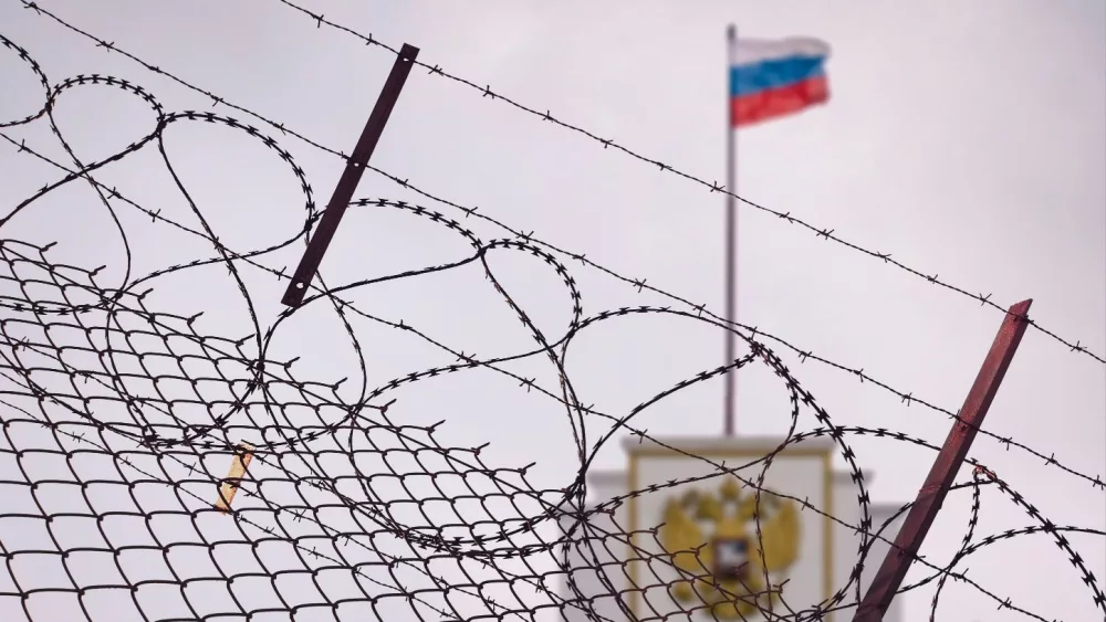 The concept of European and US sanctions pressure on the Russian Federation government. flag of the Russian Federation in barbed wire, sanctions and aggression of Russia. Russian prison