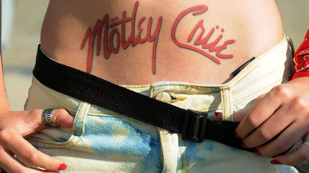 fan with tattoo with the name of the band Motley Crue waiting for the show at Rock in Rio in the city of Rio. Rio de Janeiro, Brazil, September 25, 2015.