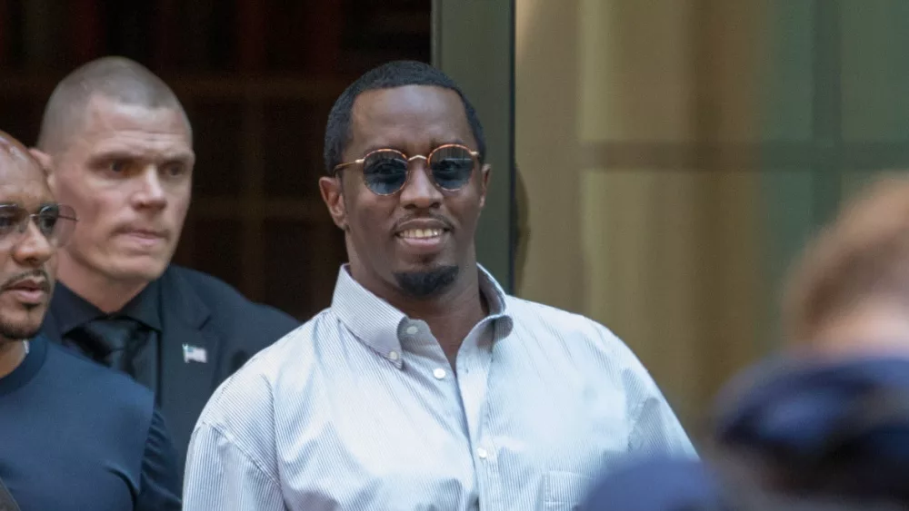 Sean “Diddy” Combs exiting the Crosby Street Hotel and heading to a waiting line of black SUV's. Lower Manhattan NYC, New York / USA - July 24, 2019