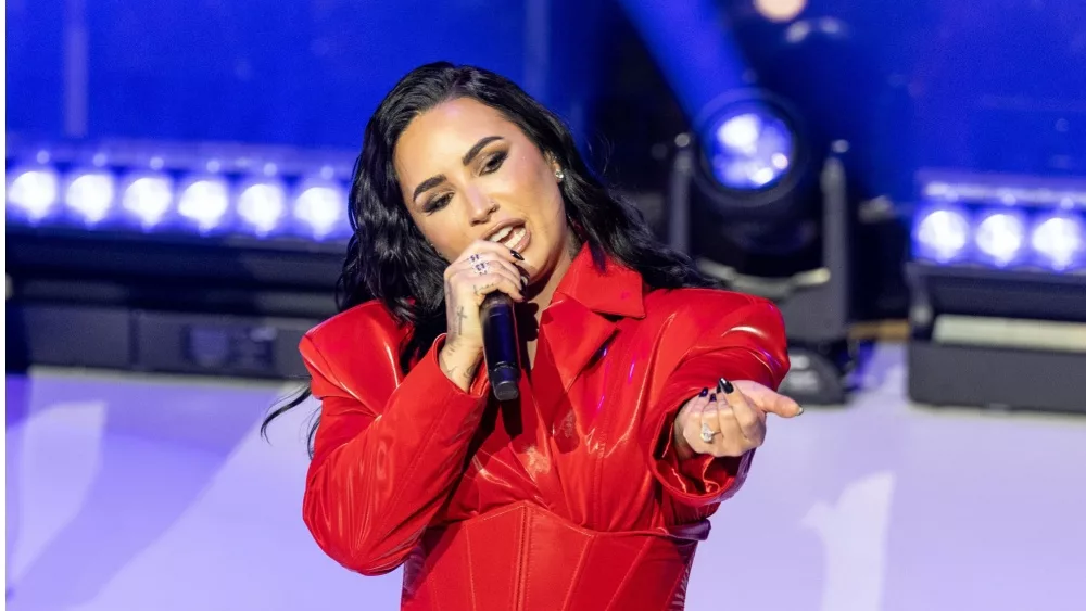 Demi Lovato wearing dress by Michael Ngo performs on stage during American Heart Association Go Red for Women and Red Dress Collection Concert at Jazz at Lincoln Center in New York on Jan 31, 2024.