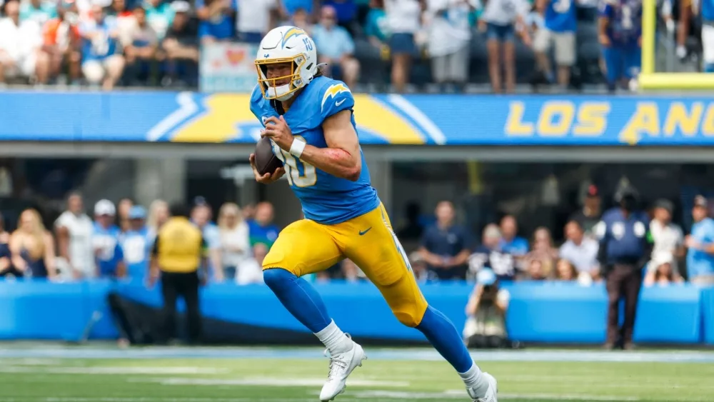 Los Angeles Chargers quarterback Justin Herbert (10) runs the ball during an NFL football game against the Miami Dolphins, Sept. 10, 2023, in Inglewood, Calif.