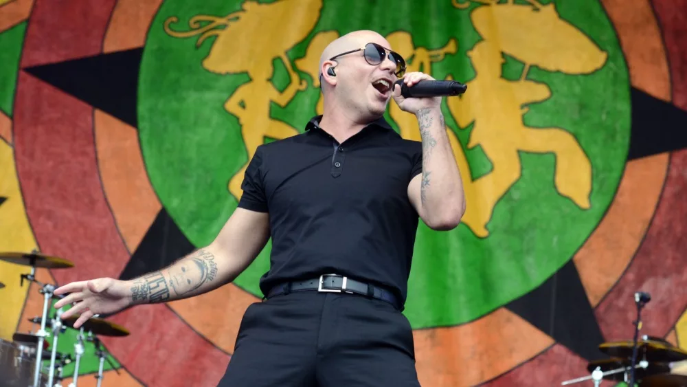 Pitbull performs at the New Orleans Jazz and Heritage Festival. New Orleans, LA - April , 2015