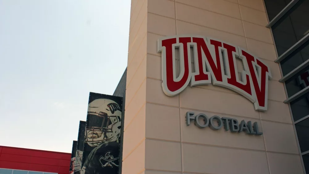 UNLV Football sign on building along with banners of images of team members. University of Nevada Las Vegas home of Rebels.Las Vegas NV: USA: July 1, 2021