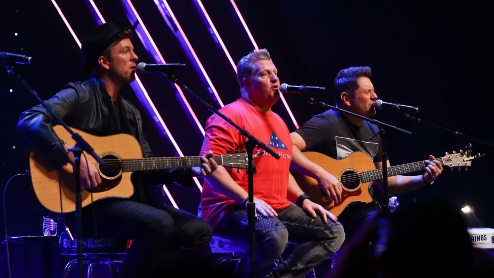 Joe Don Rooney, Gary LeVox and Jay DeMarcus (L-R) of Rascal Flatts perform at CBS Radio's Stars & Stripes event at the Chicago Theatre on November 9, 2016 in Chicago, Illinois.