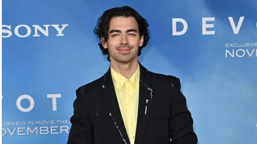 Joe Jonas at the premiere for "Devotion" at the Regency Village Theatre. LOS ANGELES, CA. November 15, 2022: