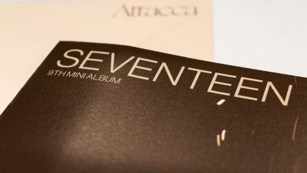 Seventeen's 9th Mini Album, "Attacca"was released in 2021. Seventeen is a South Korean K-Pop group under Pledis andHYBE. Album cover pictured.