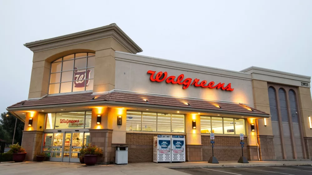 Walgreens Pharmacy store front, sign, logo entrance with drive thru. Santa Clarita, CA, USA: 2024 Sept. 14