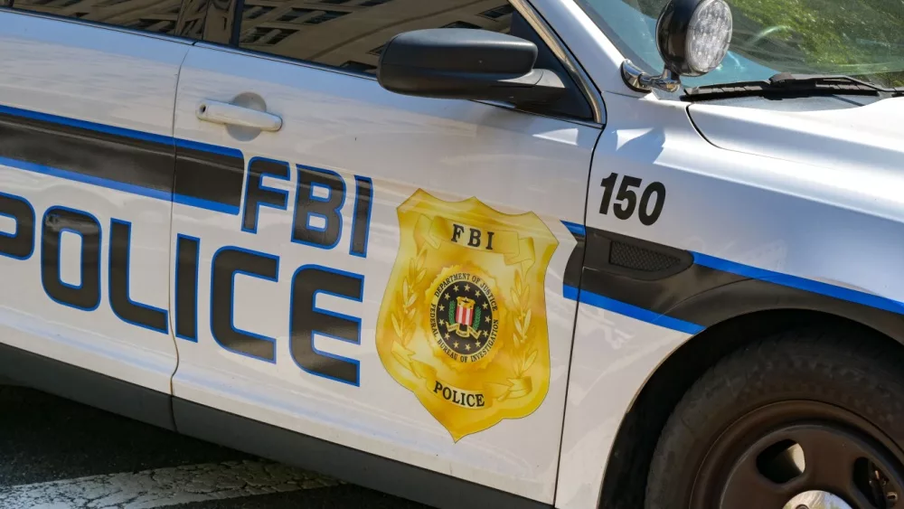 Close up view of the badge on the side of a police patrol car used by the FBI. Washington DC, USA - 30 April 2024