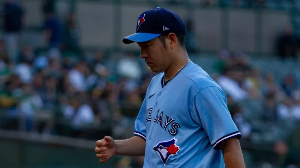 Toronto Blue Jays pitcher Yusei Kikuchi walks to the dugout during a game against the Oakland Athletics at the Oakland Coliseum. Oakland, California - July 5, 2022