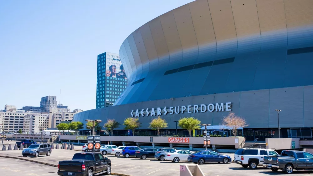 NEW ORLEANS, LA, USA - APRIL 3, 2022: Superdome with parking lot and hint of the skyline during NCAA Men's Final Four Basketball Tournament