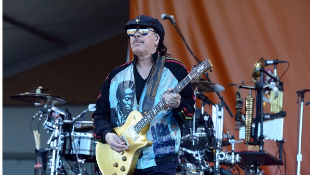 Guitar virtuoso Carlos Santana performs at the 50th Anniversary of the New Orleans Jazz and Heritage Festival on Friday, April 26, 2019.