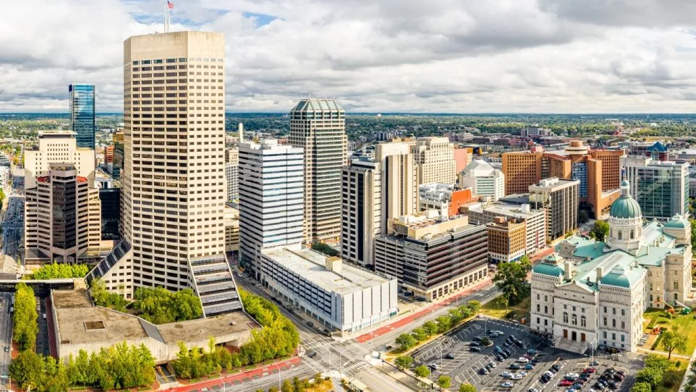 Drone view of the Indiana Statehouse and Indianapolis skyline on a late afternoon. Indianapolis is the state capital and the seat of Marion County.