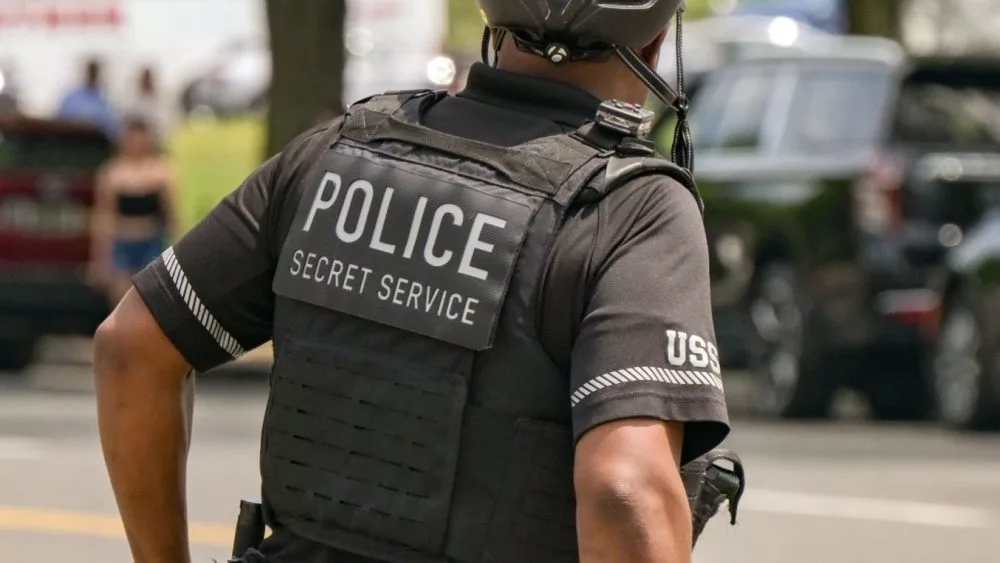 Rear view of an officer of the United States Secret Service Uniformed Division on patrol on a bicycle Washington DC, USA - 30 April 2024