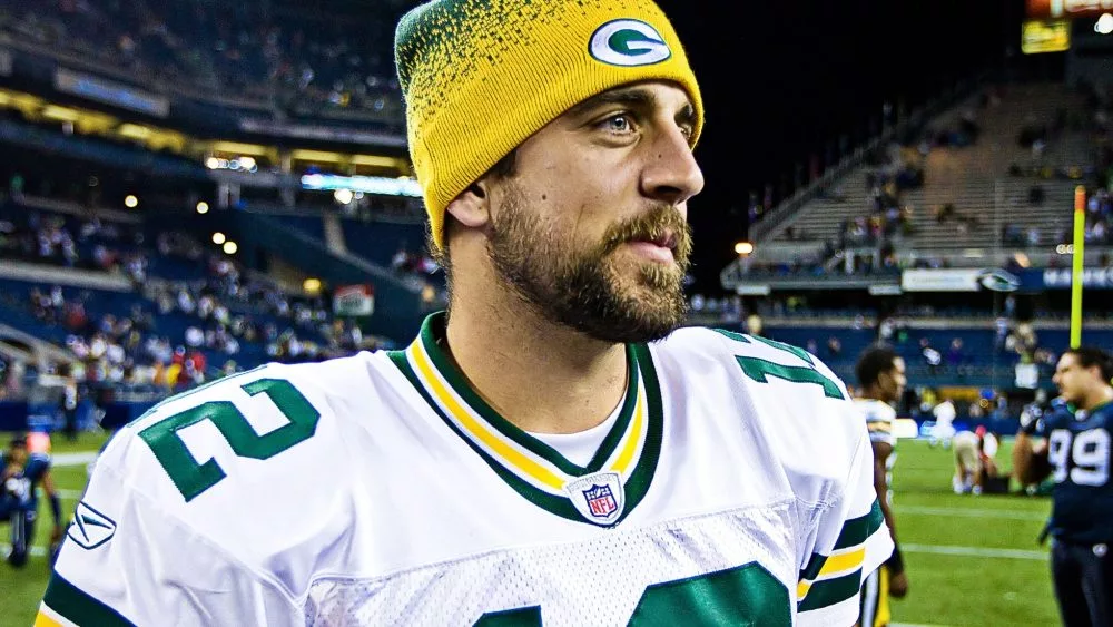 Quarterback Aaron Rodgers walks on Qwest Field after winning a football game August 21, 2010 in Seattle, Washington.