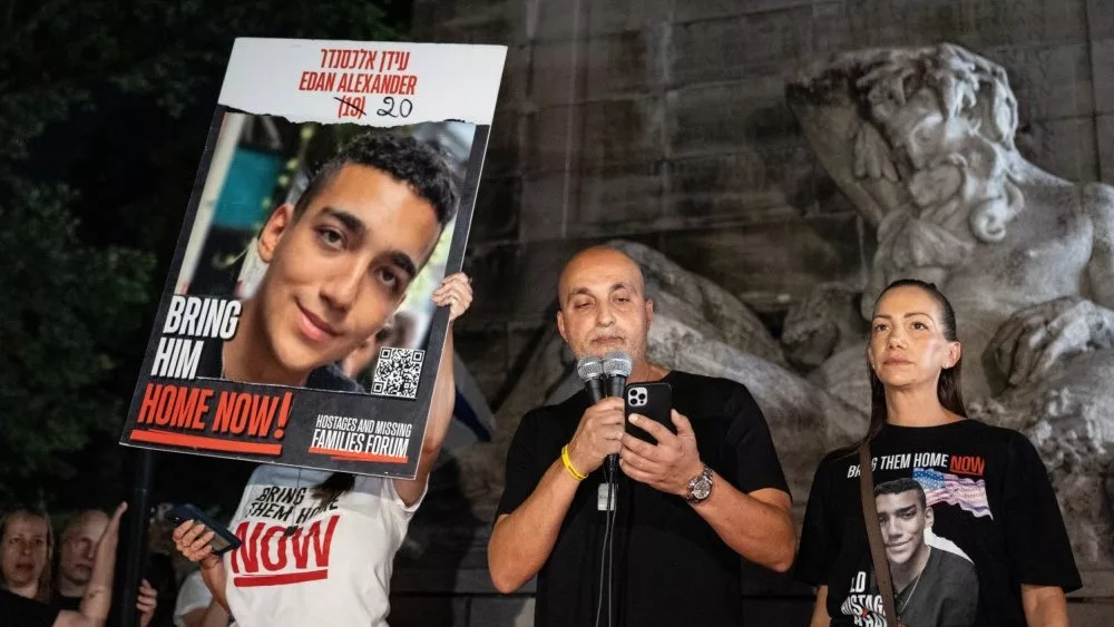 Adi Alexander speaks with Yael at his side, parents of Edan Alexander at rally and memorial service for 6 hostages who were kidnapped and murdered by Hamas on Columbus Circle in New York on Sep 1 2024