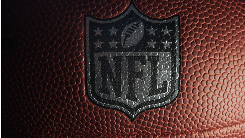 Closeup of an NFL logo on an American football