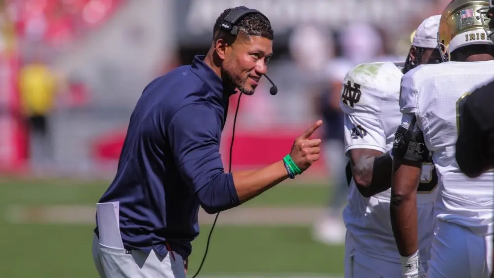 Notre Dame's Marcus Freeman congratulates his team after a score at Razorback Stadium, Fayetteville, AR. Sept 27, 2025