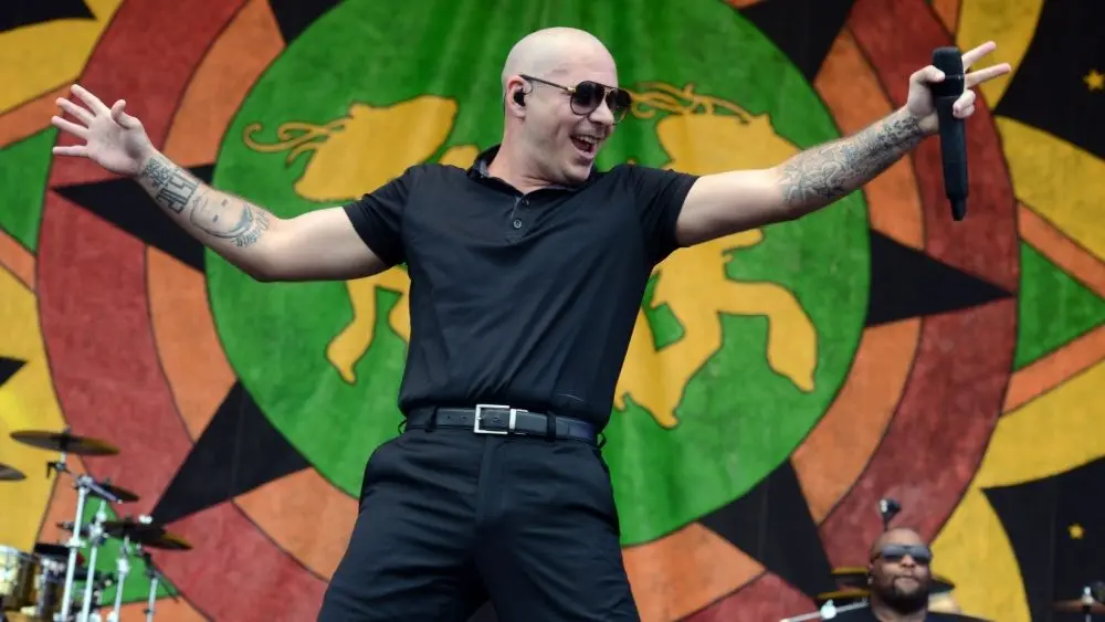 Armando Christian Pérez, known professionally as Pitbull, performs onstage at the 2015 New Orleans Jazz and Heritage Festival. New Orleans, Louisiana - April 26, 2015