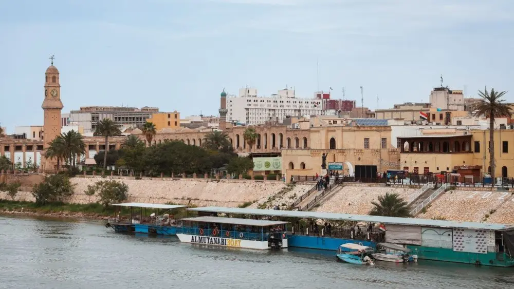 Historic buildings and riverboats on the Tigris River in Baghdad, Iraq Baghdad, Iraq - March 22, 2025