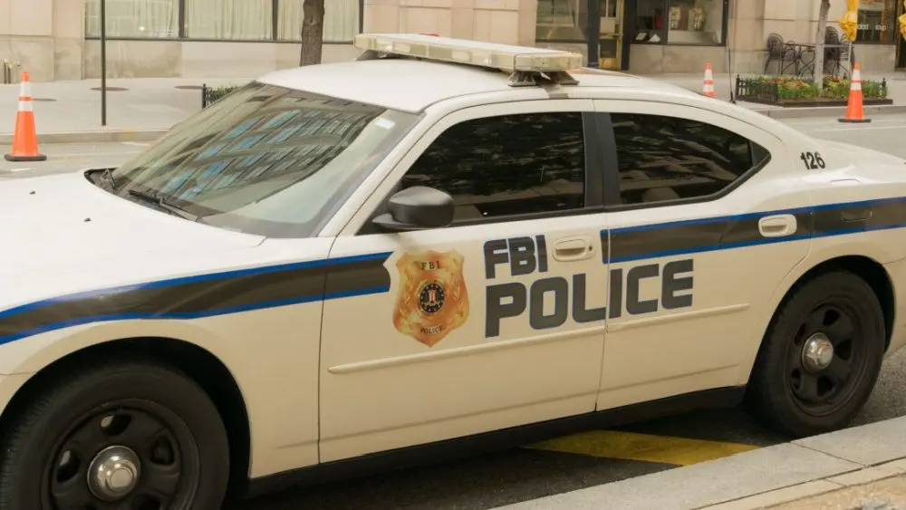 BI Police car is waiting at the J. Edgar Hoover FBI Building - United States of America