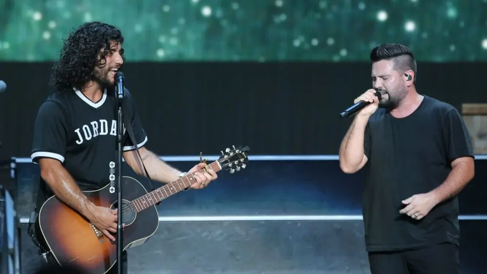 Dan Smyers (L) and Shay Mooney of Dan + Shay perfor during the "Can't Say I Ain't Country" Tour on July 20, 2019 at Northwell Health at Jones Beach Theater in Wantagh, New York.