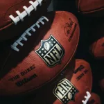 Rows of american football balls in NFL Experience in Times Square^ New York