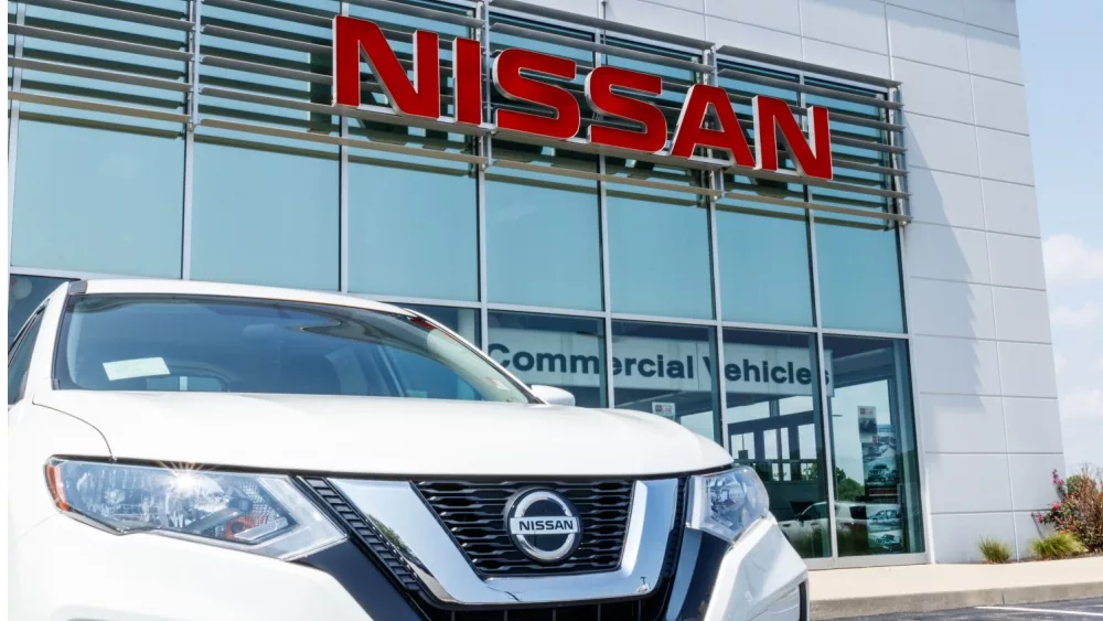 New vehicles at a Nissan Car and SUV Dealership. Nissan is part of the Renault–Nissan Alliance VII