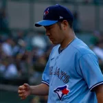 Toronto Blue Jays pitcher Yusei Kikuchi walks to the dugout during a game against the Oakland Athletics at the Oakland Coliseum. Oakland^ California - July 5^ 2022