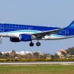 Azerbaijan Airlines Airbus A319-111 (REG: 4K-AZ05) on finals runway 31^ bringing the national football team for a match with Malta. Luqa^ March 23^ 2022