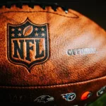 NFL Leather Ball and Emblem in Focus. National Football League official ball