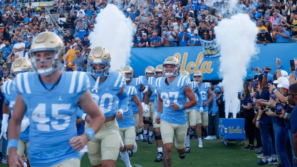 UCLA players run out of the tunnel before an NCAA college football game between the UCLA and the Colorado^ Oct. 28^ 2023^ in Pasadena^ Calif.