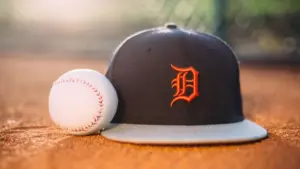 MLB Baseball ball with Detroit Tigers cap on pitchers mound.