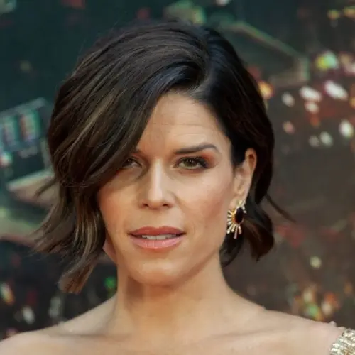 Neve Campbell wearing dress by Barney Cheng Couture attends the premiere of Skyscraper at AMC Loews Lincoln Center New York^ NY - July 10^ 2018