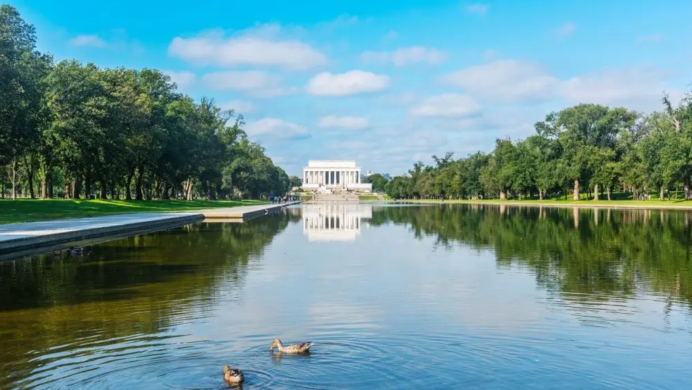 World famous Lincoln Memorial reflected in the water under a cloudy sky. Washington D.C.^ USA