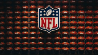 new-york-usa-may-28-2018-rows-of-american-football-balls-in