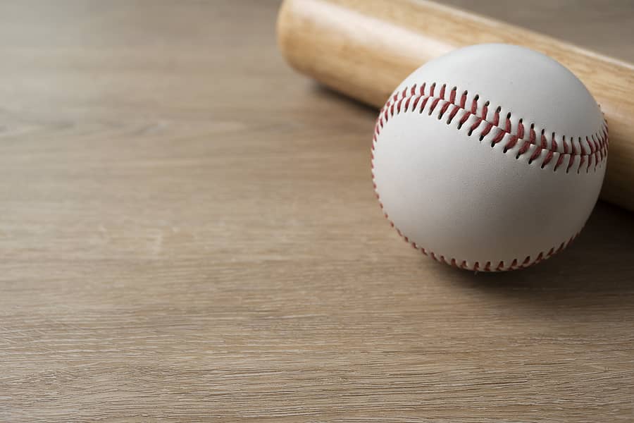 close-up-baseball-and-baseball-bat-on-wooden-table-background-s