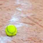 old-softball-in-a-softball-field-in-california-mountains-on-a-wh