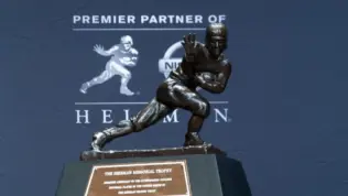 New York^ NY - December 14^ 2019: Heisman Memorial Trophy trophy on display at the Marriott Marquis Hotel