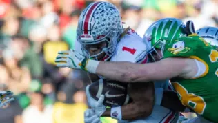 Ohio State running back Quinshon Judkins #1 runs the ball fighting off pressure from Oregon during the 2025 Rose Bowl game Wednesday^ Jan. 1^ 2024^ in Pasadena^ Calif.