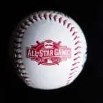 Close up baseball printed with logo for the 2015 Major League Baseball All-Star Game isolated on a dark black background. Cincinnati^ Ohio^ USA - July 21 2022