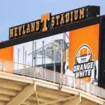Neyland Stadium is home to the University of Tennessee Volunteer sports teams^ primarily the football team. The stadium has a capacity of 101^915 people. Knoxville^ TN^ USA - April 12^ 2025