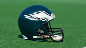 Philadelphia eagles NFL club helmet on the green playing field ^ product shot