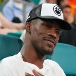 Jimmy Butler^ basketball player for the Miami Heat^ attends the semifinal match at 2023 Miami Open at the Hard Rock Stadium in Miami MIAMI GARDENS^ FLORIDA - MARCH 31^ 2023