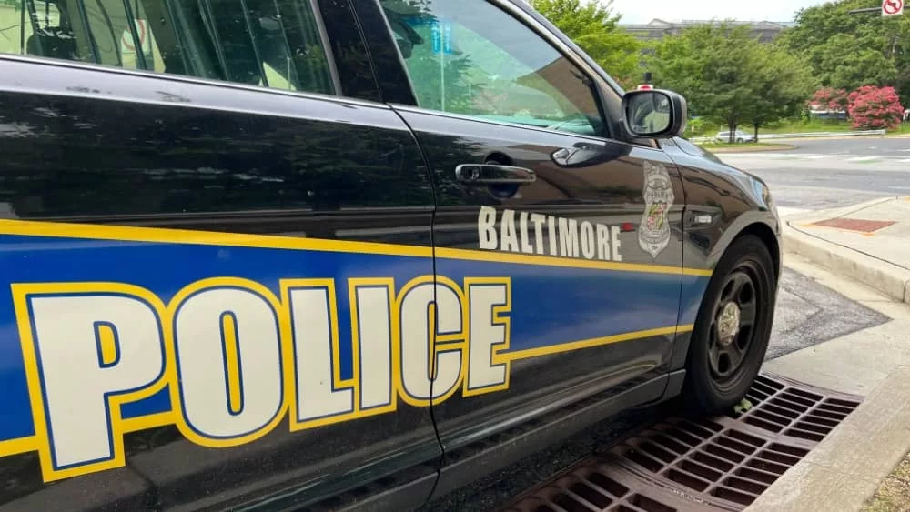 BALTIMORE^ MARYLAND - JULY 29^ 2023: Baltimore Maryland police department sign on police cruiser